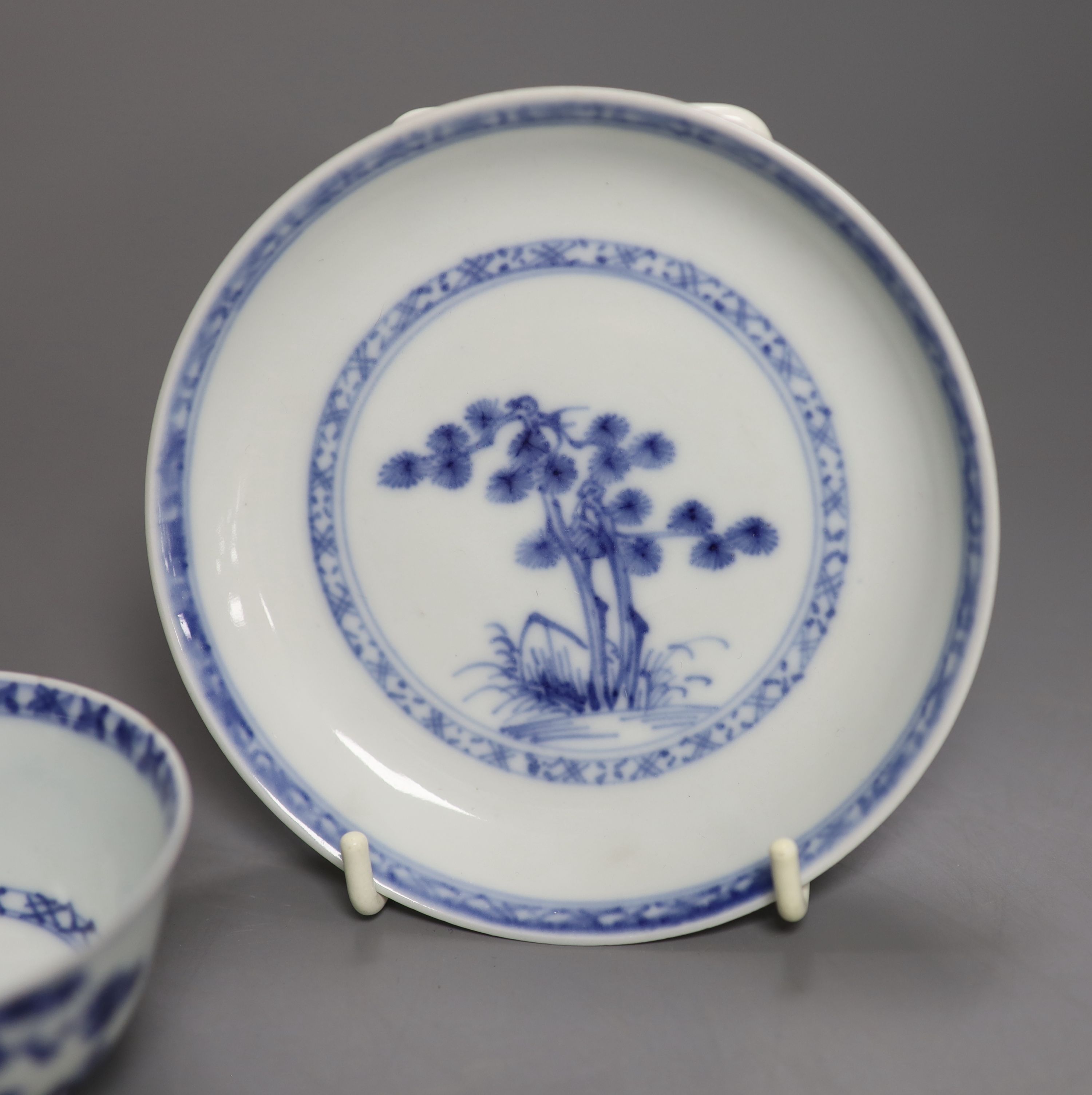 A Chinese 18th century Nanking Cargo blue and white tea bowl and saucer and a small blue and white octagonal plate, W 16cm (plate)